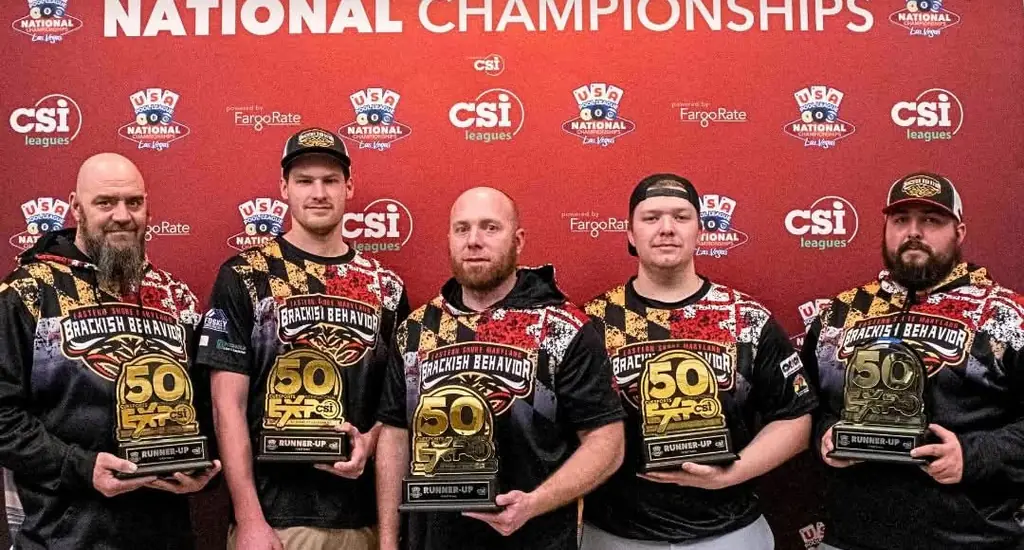 Five Brackish Behavior players in Maryland-flag jerseys holding runner-up trophies